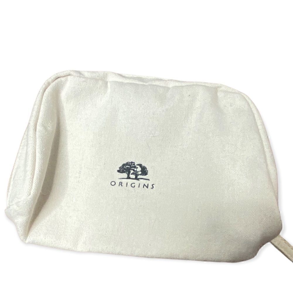 Origins cream canvas make up bag with zip closure small marks inside